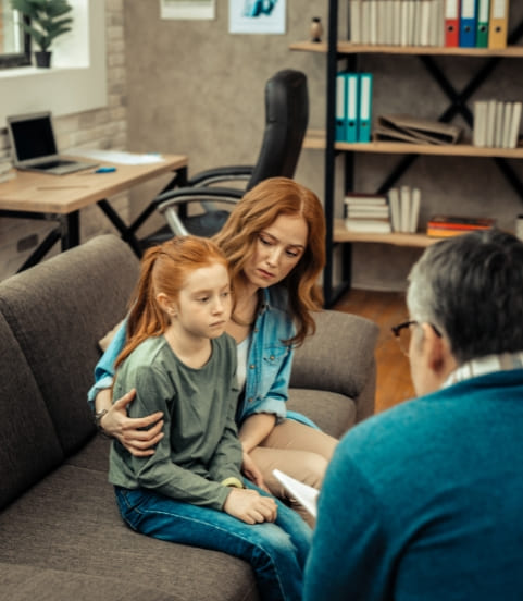 A girl child sitting with Clinical Psychologists for psychoeducational assessment in Mississauga center.